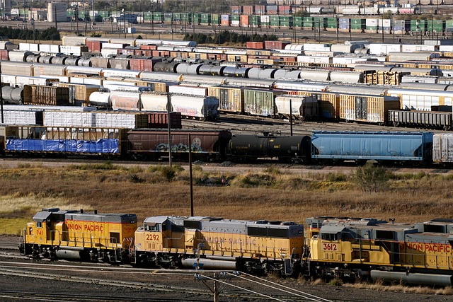 View of a trainyard showing multiple tracks filled with train cars.